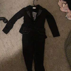 Black jeans black coat and black and white shirt!